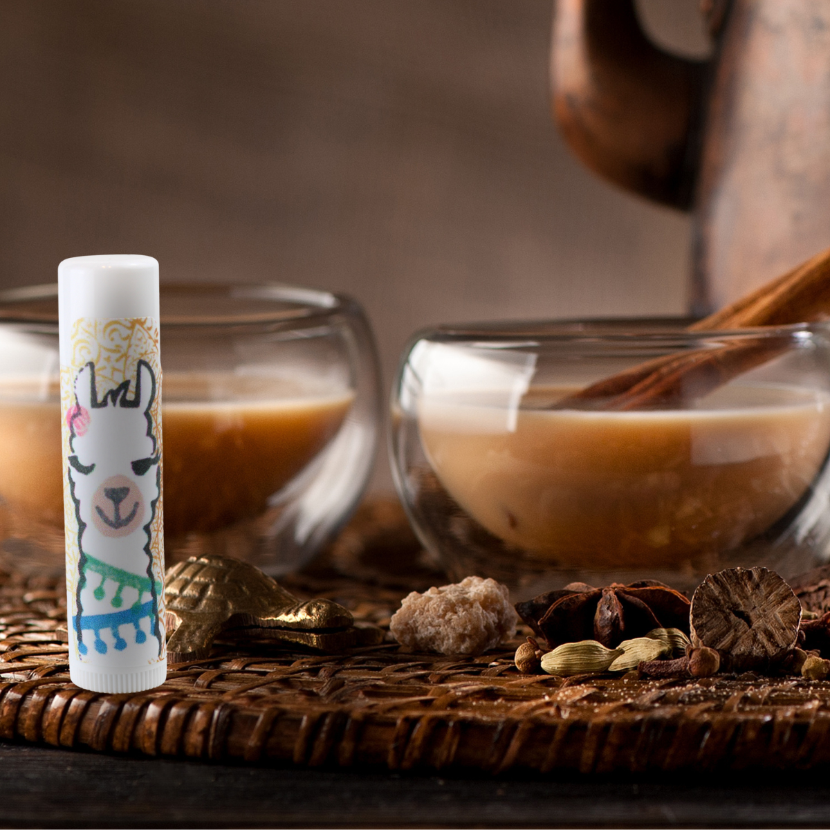 Chai Flavored Lip Balm in photo with cups of Chai Alpaca Soaps, AlpacaSoaps